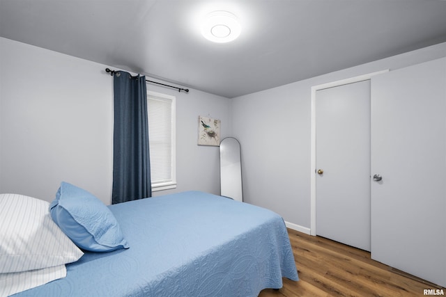 bedroom featuring wood-type flooring