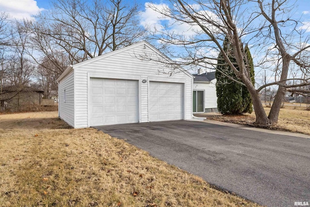 garage featuring a yard