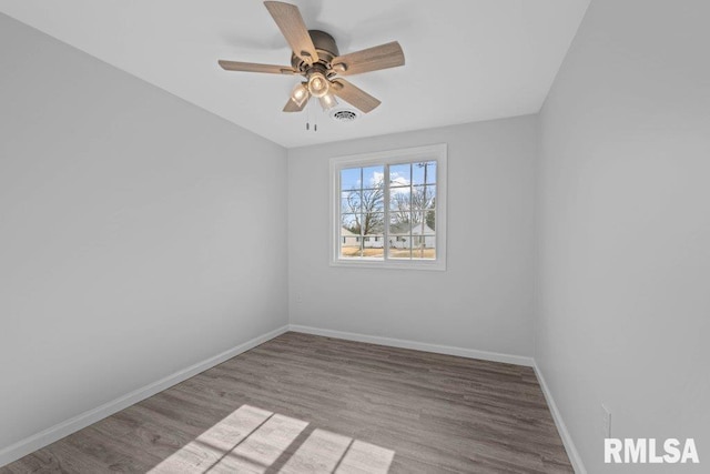 empty room with light hardwood / wood-style flooring and ceiling fan