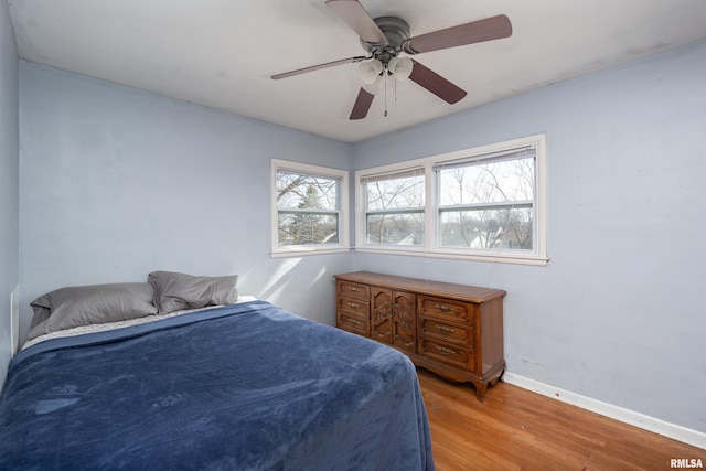 bedroom featuring ceiling fan and light hardwood / wood-style floors