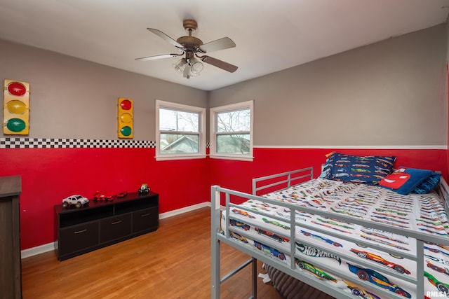 bedroom featuring wood-type flooring and ceiling fan