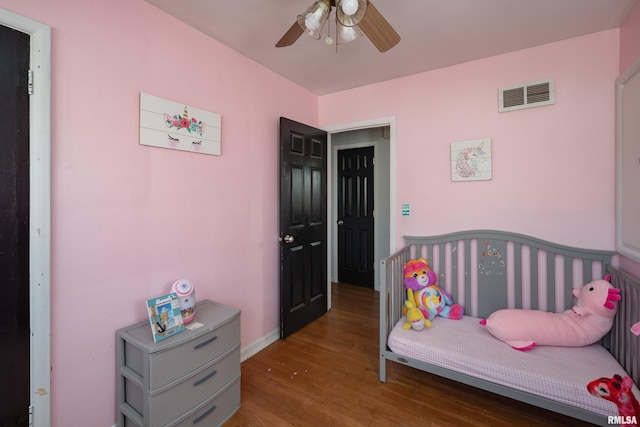 bedroom featuring wood-type flooring and ceiling fan