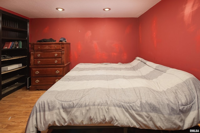 bedroom with light hardwood / wood-style floors