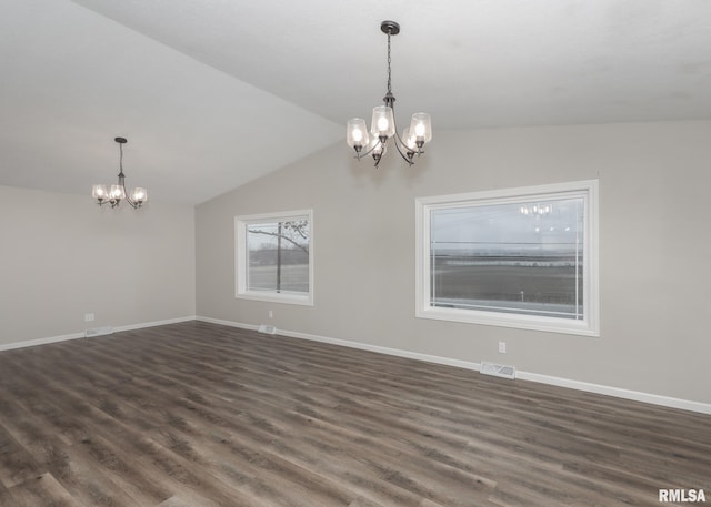 interior space featuring lofted ceiling, a notable chandelier, and dark hardwood / wood-style floors