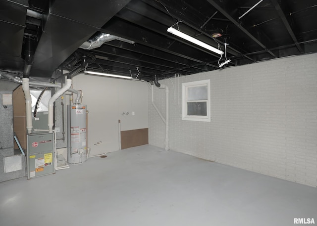 basement featuring heating unit and gas water heater