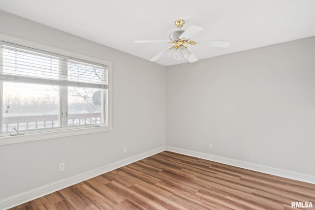 unfurnished room with hardwood / wood-style flooring and ceiling fan