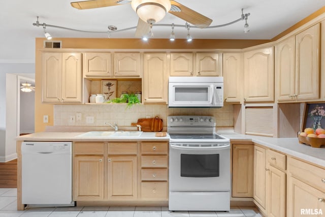 kitchen with sink, white appliances, ceiling fan, and light brown cabinets