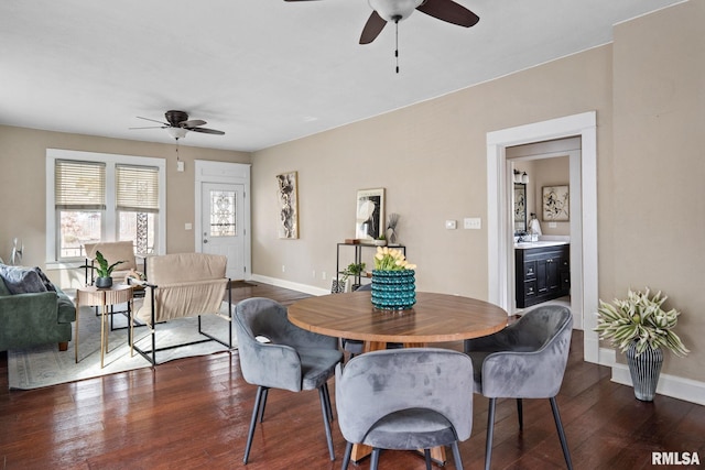 dining area featuring dark wood-type flooring and ceiling fan