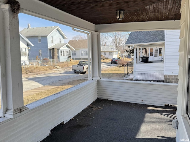 unfurnished sunroom with wood ceiling