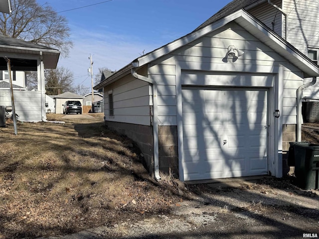 garage featuring driveway