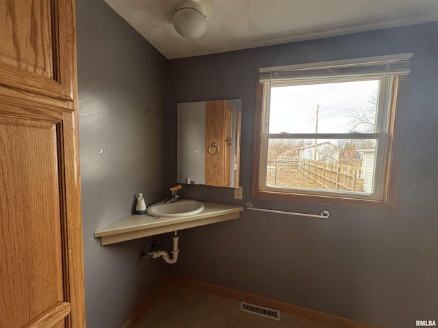 bathroom featuring tile patterned floors and sink