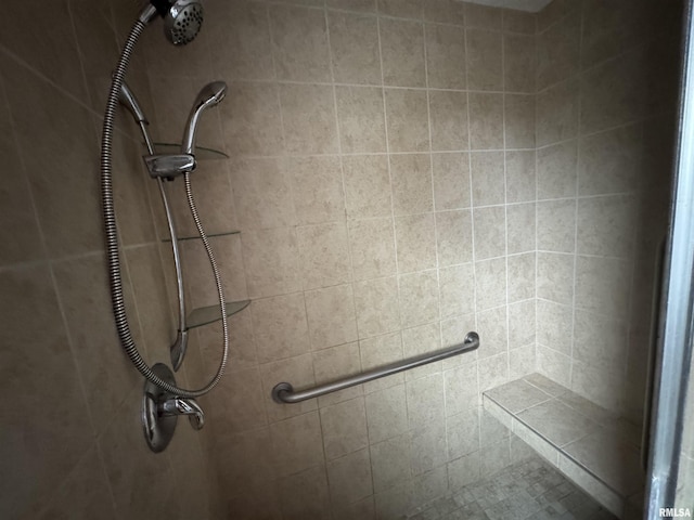 bathroom with a tile shower