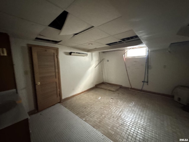 basement with a drop ceiling