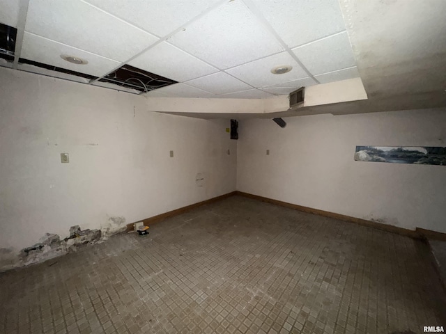 basement featuring a drop ceiling