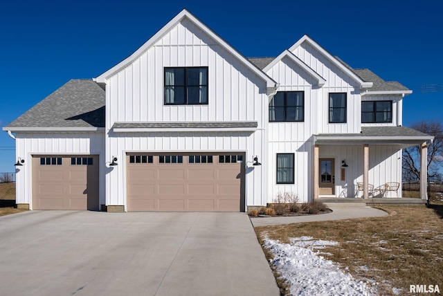 modern farmhouse with a garage and covered porch