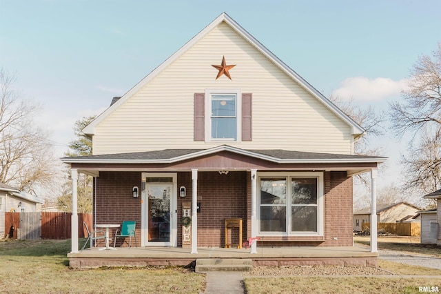 view of front facade with a front lawn and a porch