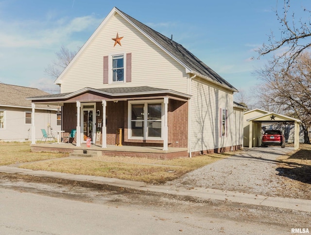 view of front of property with a carport and covered porch