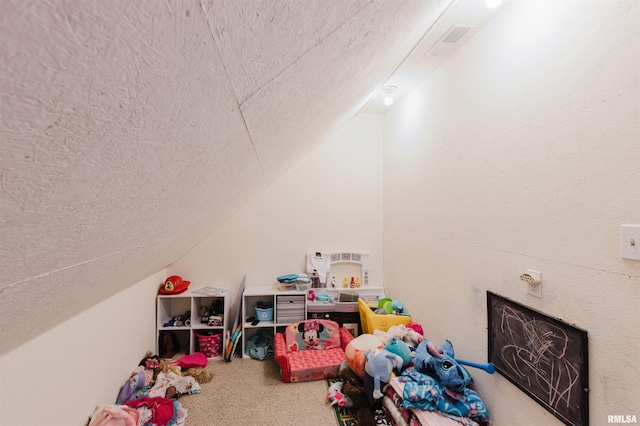 recreation room featuring lofted ceiling and carpet floors