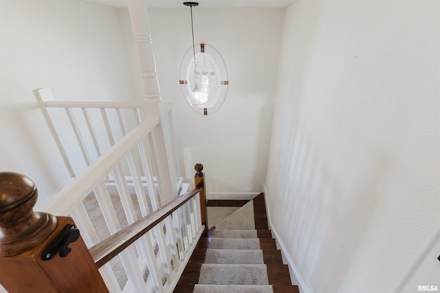 stairway featuring hardwood / wood-style floors