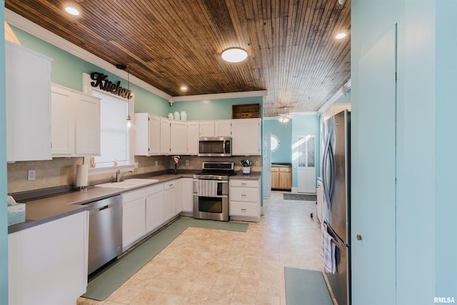 kitchen featuring sink, stainless steel appliances, and white cabinets