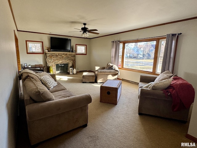 living room featuring crown molding, ceiling fan, a stone fireplace, and carpet