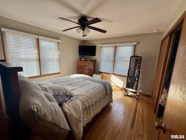 bedroom with ceiling fan and wood-type flooring