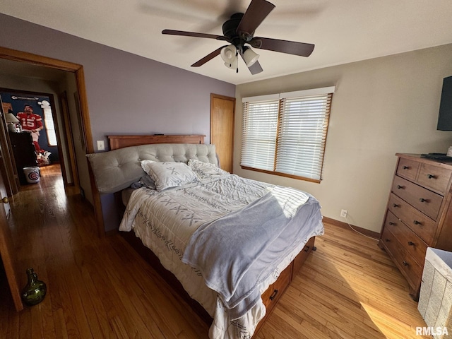 bedroom featuring ceiling fan and light wood-type flooring