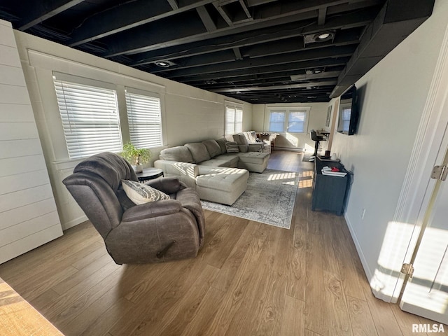 living room with light hardwood / wood-style flooring