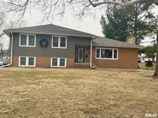 split level home featuring a front lawn