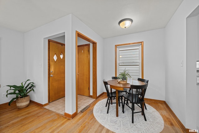 dining room featuring light hardwood / wood-style flooring