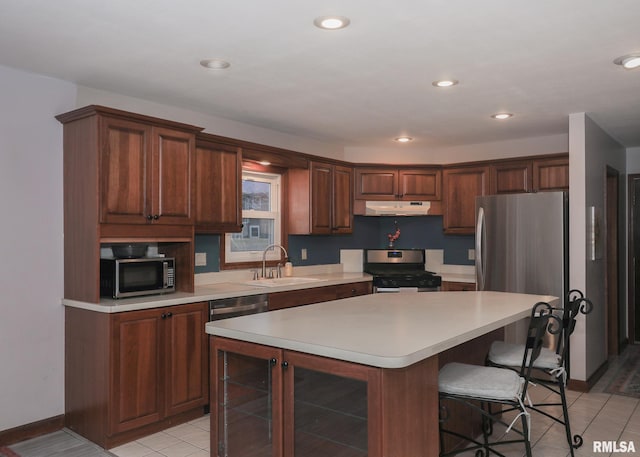 kitchen featuring sink, wine cooler, a center island, light tile patterned floors, and stainless steel appliances