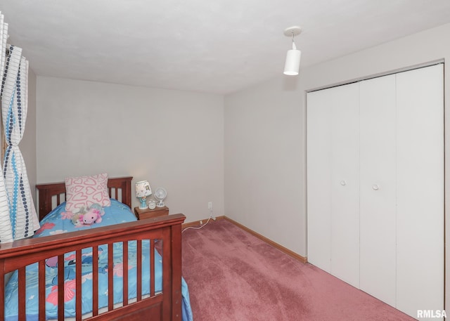 carpeted bedroom featuring a closet