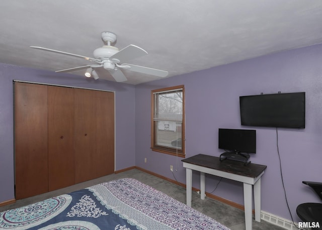 interior space featuring ceiling fan and a closet