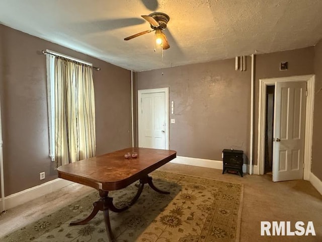 misc room featuring ceiling fan and a textured ceiling