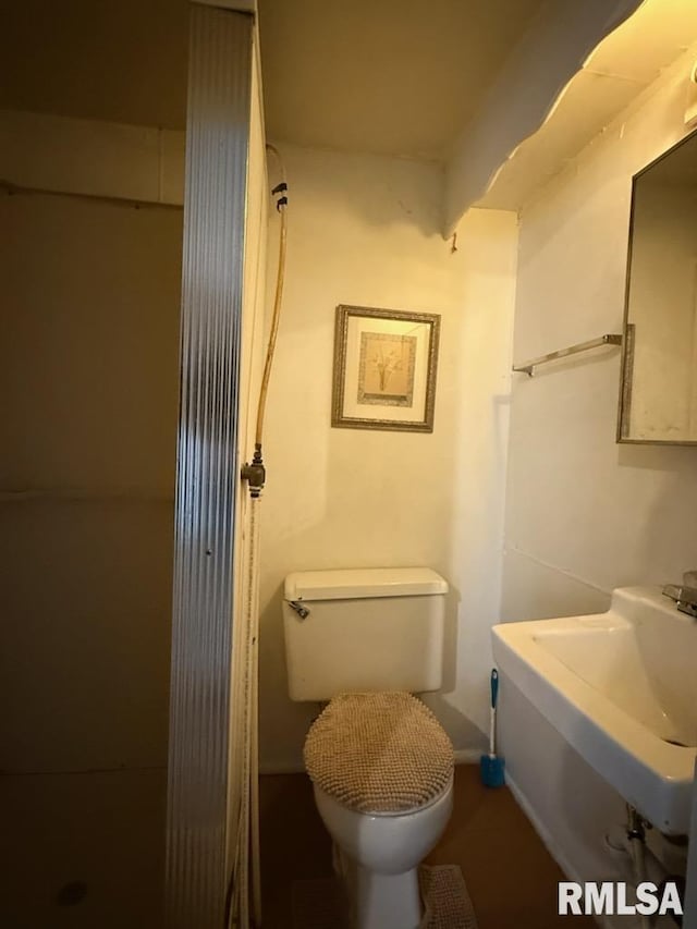 bathroom featuring toilet