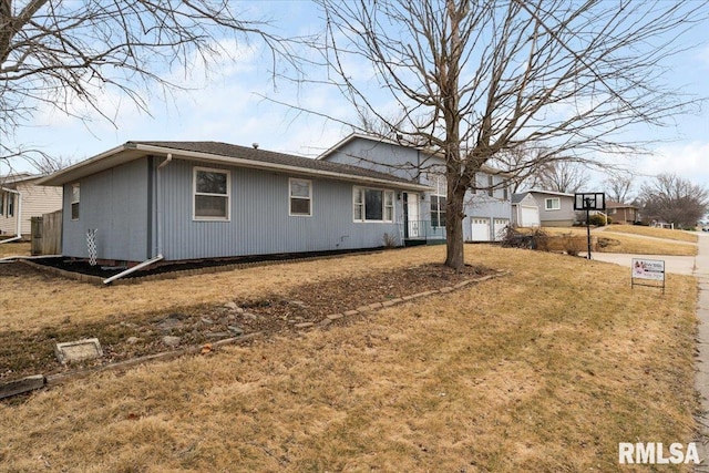 view of property exterior with a yard