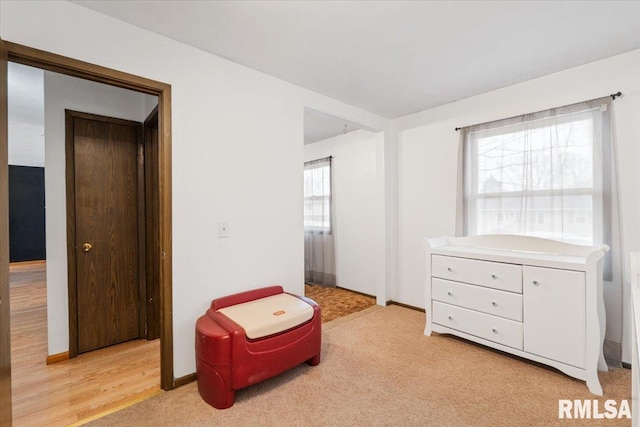 living area featuring light colored carpet