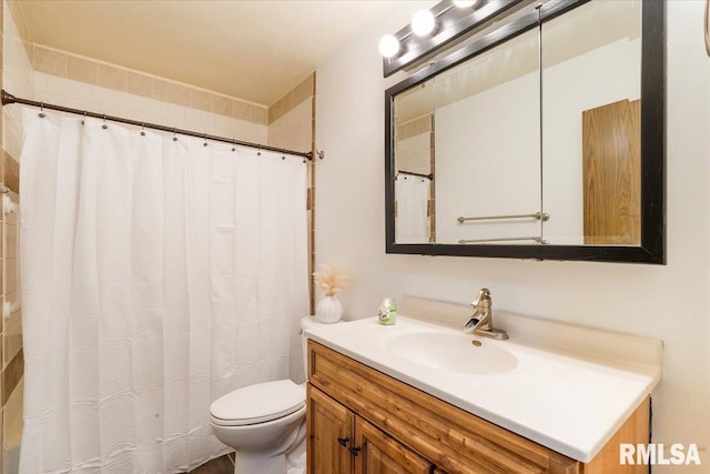 bathroom featuring vanity, a shower with shower curtain, and toilet