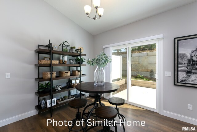 LOT38 Frank Ct, Le Claire, IA 52753 - dining space featuring baseboards, vaulted ceiling, a notable chandelier, and wood finished floors