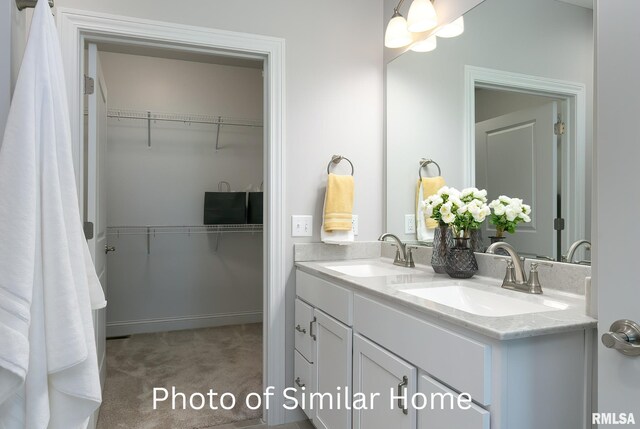 LOT38 Frank Ct, Le Claire, IA 52753 - bathroom with double vanity, a sink, and a walk in closet