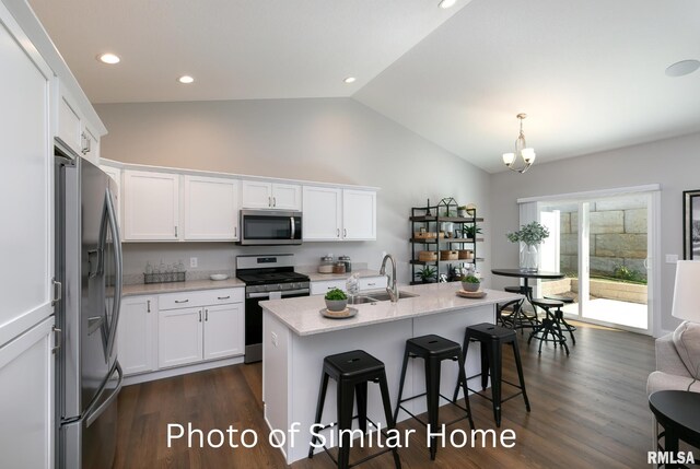 LOT38 Frank Ct, Le Claire, IA 52753 - kitchen featuring a kitchen breakfast bar, stainless steel appliances, a sink, dark wood-style floors, and white cabinets