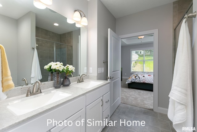 bathroom featuring vanity, tile patterned floors, and walk in shower