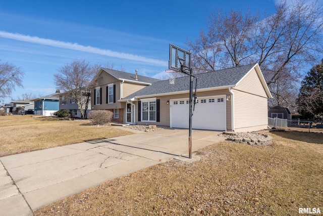 view of front of property with a garage and a front lawn