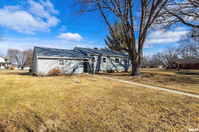 ranch-style home featuring a front yard