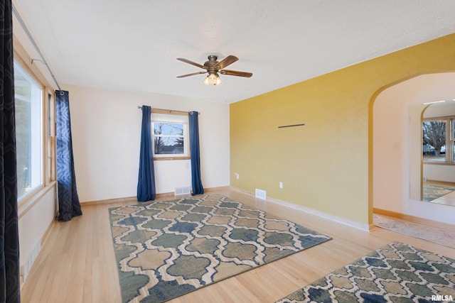 spare room featuring ceiling fan and hardwood / wood-style floors