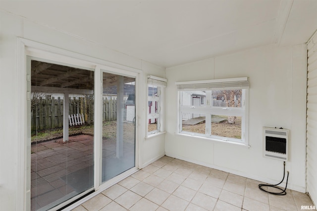 unfurnished sunroom with heating unit