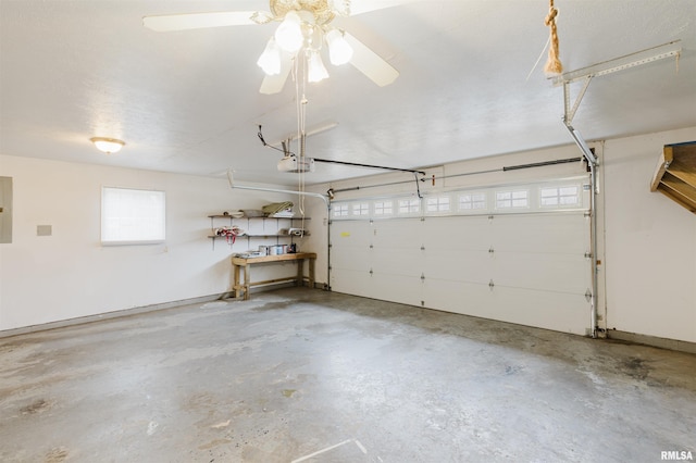 garage featuring a garage door opener and electric panel