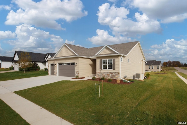 view of front of home with a garage and a front yard