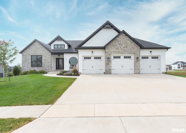 view of front of home with a garage and a front lawn