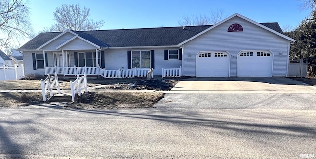 single story home featuring a garage and a porch